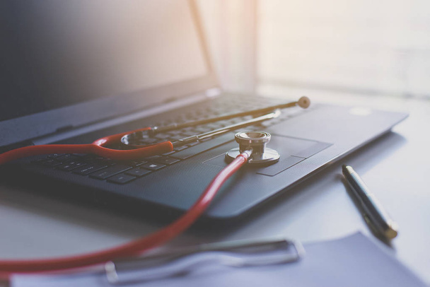 Close up of red stethoscope on desk,Healthcare and medical concept,Selective focus - Photo, Image