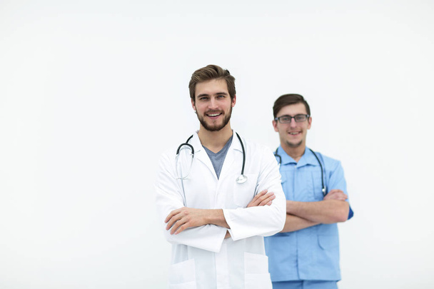 confident doctor and assistant .isolated on white - Fotoğraf, Görsel