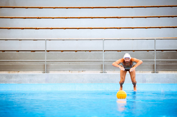 Water polo player in a swimming pool. - Foto, imagen