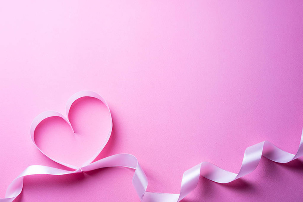 Valentines Day background with pink heart. Heart shape from ribbons - Foto, Bild