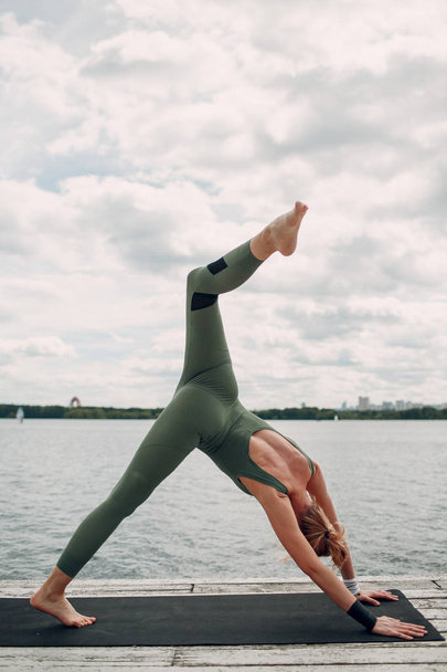 Yoga woman on coast - Photo, Image