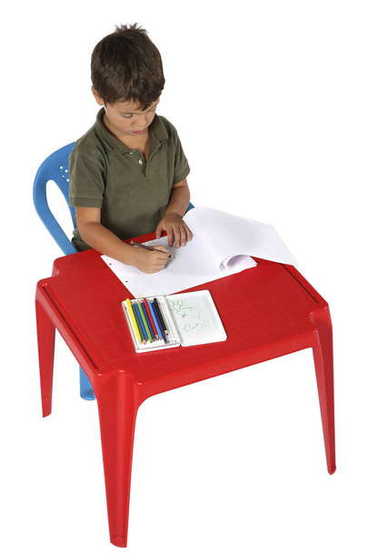 Child with red desk - Foto, Imagen