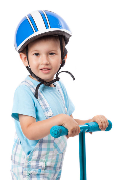 Little boy in protection helmet and scooter, isolated on white - 写真・画像