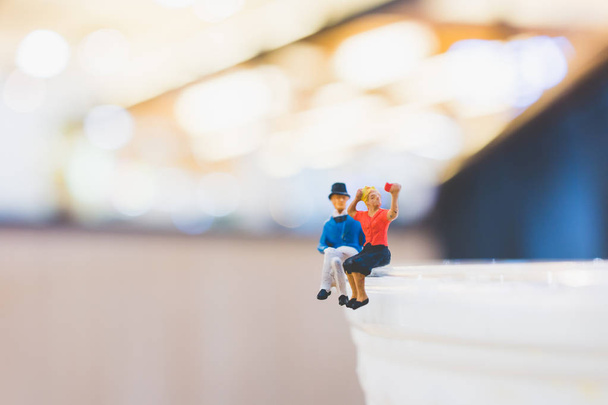 Miniature people : Couple sitting on cup , Valentine day's conce - Photo, Image