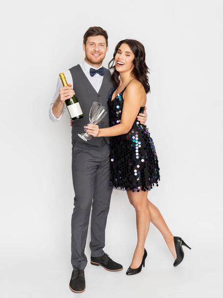 happy couple with champagne and glasses at party - Photo, image