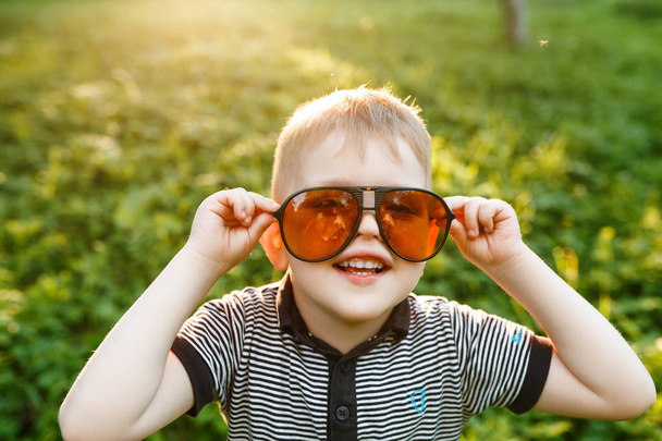 stylish little Boy in sunglasses at summer time  - Foto, Imagen