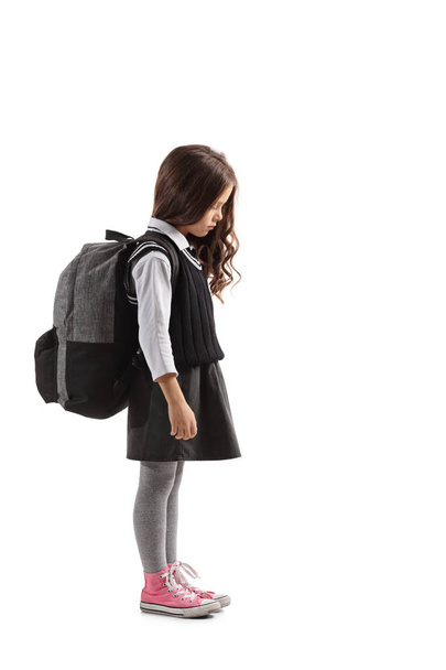 Sad little schoolgirl with a backpack - Foto, Imagen