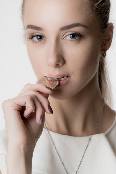 Beautiful girl with silver bitcoin in hand - Foto, Bild