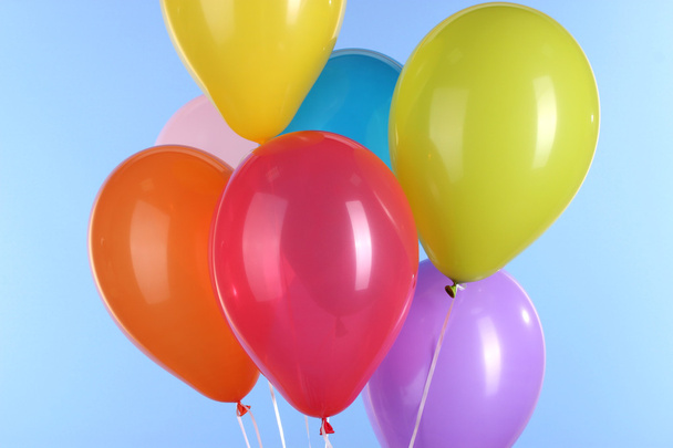 colorful balloons on blue background - Foto, Imagen