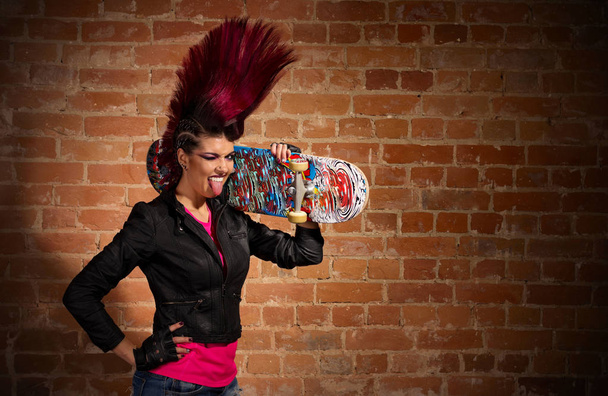 Punk girl on brick wall background - Zdjęcie, obraz