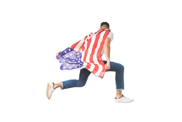 back view of young man with american flag jumping isolated on white - Photo, image
