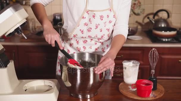 close up shot of the chefs , who mixes the cream with a spatula in a large bowl - Footage, Video