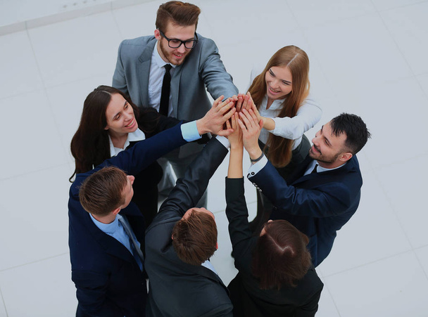 Top view of business people with their hands together in a circle. - 写真・画像
