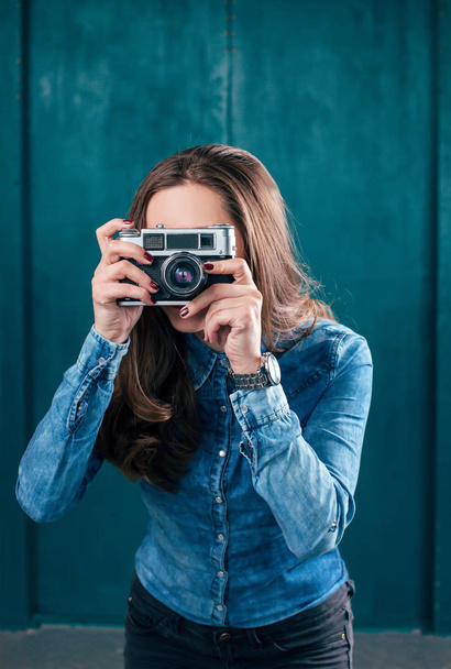 Young beautiful Girl with retro camera - 写真・画像