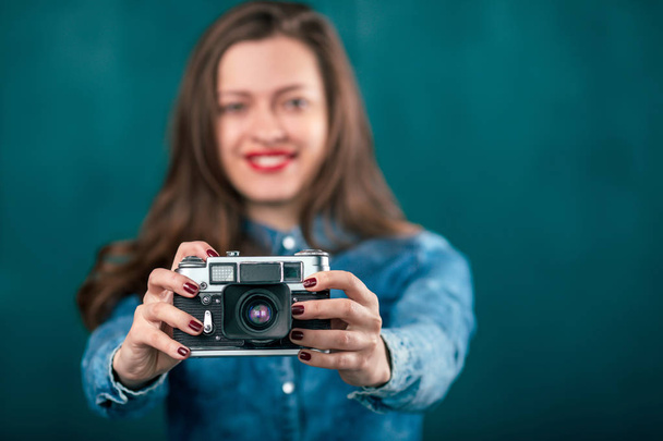 Young beautiful Girl with retro camera - Фото, изображение