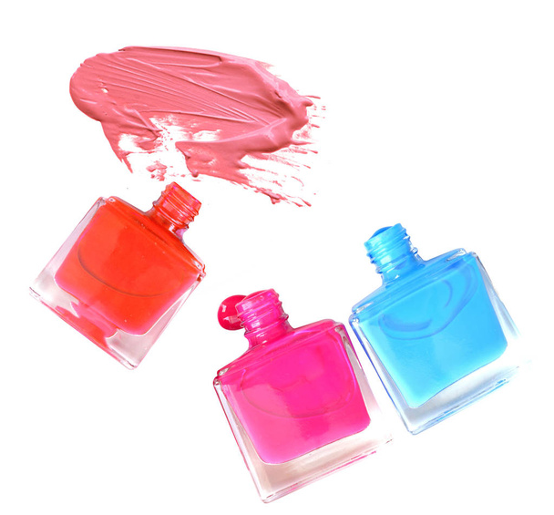 Colorful nail polishes bottles isolated on white. - Photo, Image