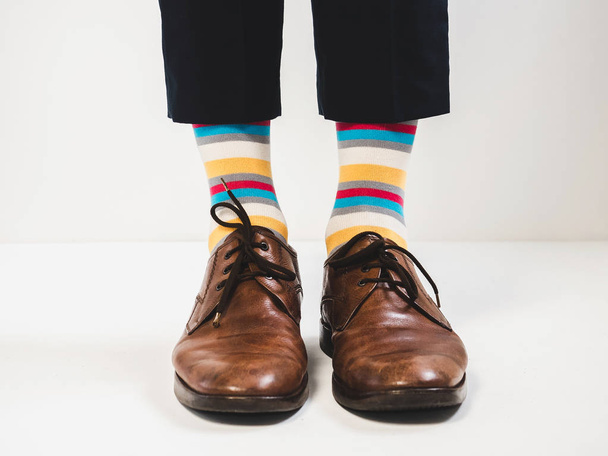 Men's feet in stylish shoes and bright socks - Фото, изображение