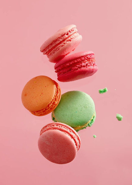 Sweet french macarons on pink background.  - Zdjęcie, obraz