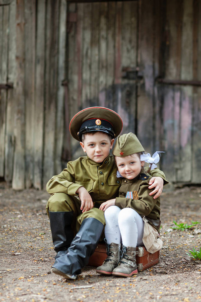 Children in uniform.Soldiers,the defenders of the Fatherland. "I remember, I'm proud!".Military history.defender of Fatherland. Military theme.Military uniform. - Photo, Image