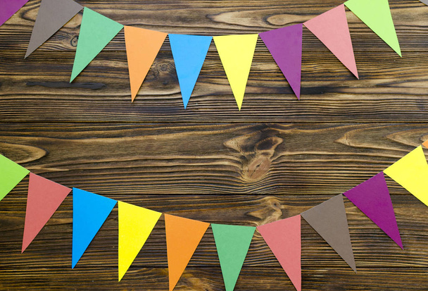 paper  flags  party garland  on wooden background - Photo, Image