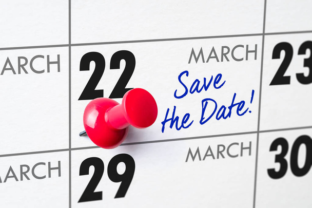Настінний календар з червоною шпилькою 22 березня
 - Фото, зображення