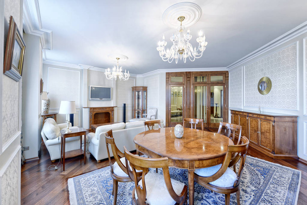 Large dining table in the interior of the house. - Photo, Image