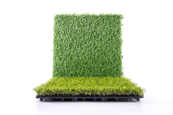 Grass mat on white background. Artificial turf tile background. Object and background concept. - Photo, Image