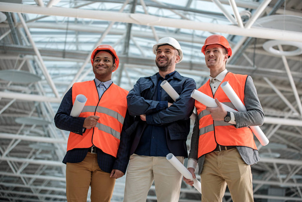 Positive confident engineers are attending construction - Photo, image