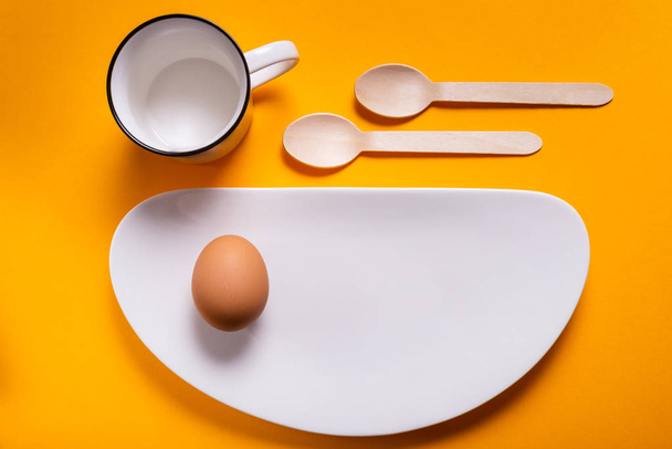 Simple breakfast, boiled egg on white porcelain - Fotoğraf, Görsel