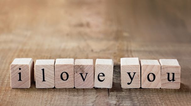 Message I love you spelled in wooden blocks - Foto, Imagen