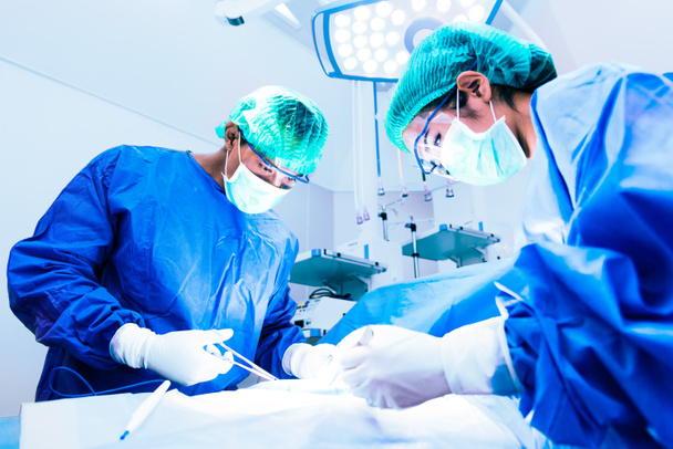 Doctor and assistant nurse operating for help patient from dangerous emergency case, Hospital and Surgery Concept, Health care and Medical concept, Cancer and disease treatment - Foto, Bild