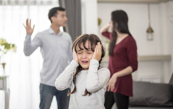 Little girl was crying because dad and mom quarrel, Sad and dramatic scene, Family issued, Children's Rights abused in Early Childhood Education and Social and parents care problem concept - Photo, Image