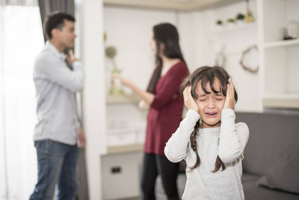 Little girl was crying because dad and mom quarrel, Sad and dramatic scene, Family issued, Children's Rights abused in Early Childhood Education and Social and parents care problem concept - Foto, Imagen