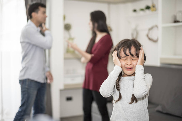 Little girl was crying because dad and mom quarrel, Sad and dramatic scene, Family issued, Children's Rights abused in Early Childhood Education and Social and parents care problem concept - Photo, Image