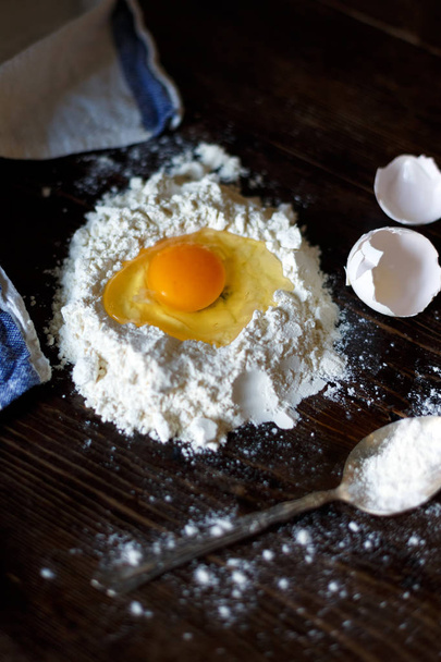 flour and egg on a wooden table - Foto, Imagem