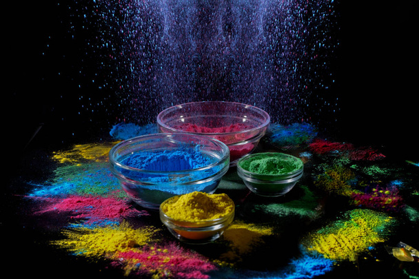 Indian Holi festival colours. Several bowls with Holi paint powder. Explosion of blue color. - Photo, Image