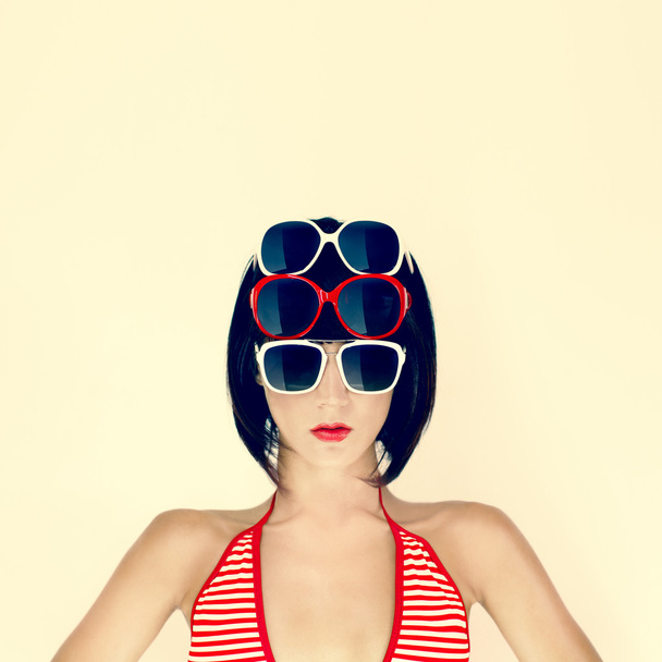 Portrait of a young girl in stylish glasses - Valokuva, kuva