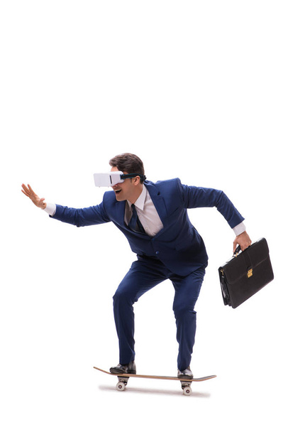 Businessman wearing virtual reality glasses riding skateboard on - Φωτογραφία, εικόνα