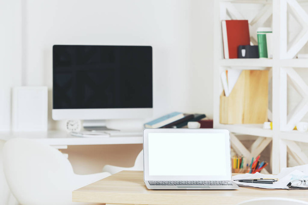 Designer workspace with blank white laptop - Foto, Bild