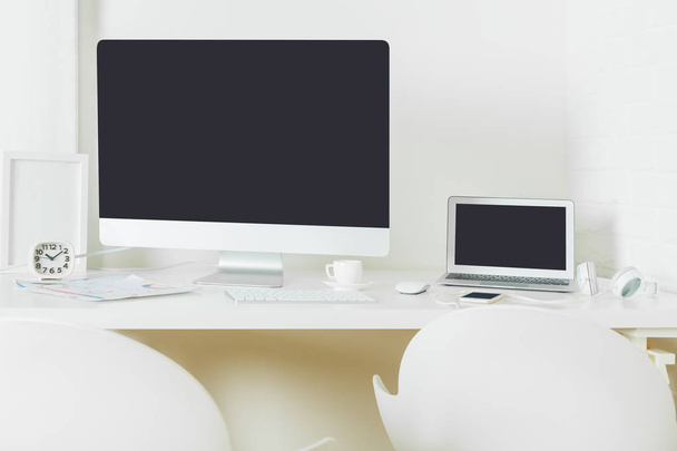 Stylish workplace with empty laptop screen - Photo, image