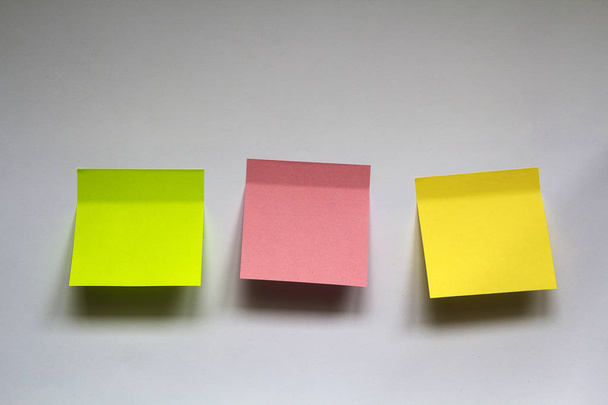 Blank colorful sticky notes isolated on white wall background - Photo, Image