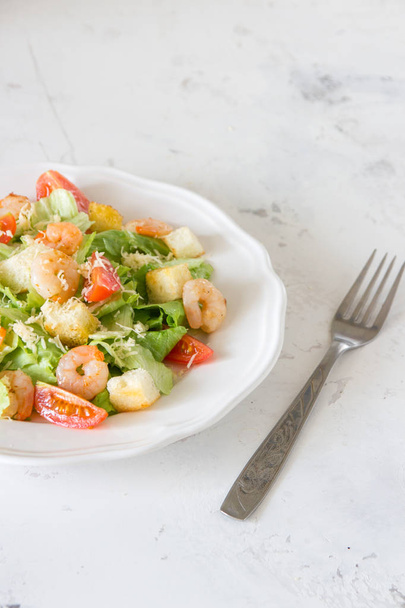Caesar salad with shrimps on a white background - Photo, Image