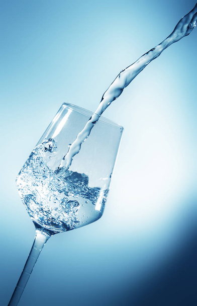 glass with ice and liquid splash - Foto, imagen