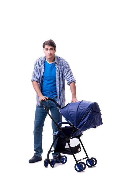Young dad with baby pram isolated on white - Foto, afbeelding