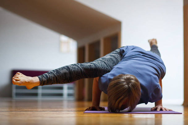 Close up of young woman practicing yoga - Photo, image