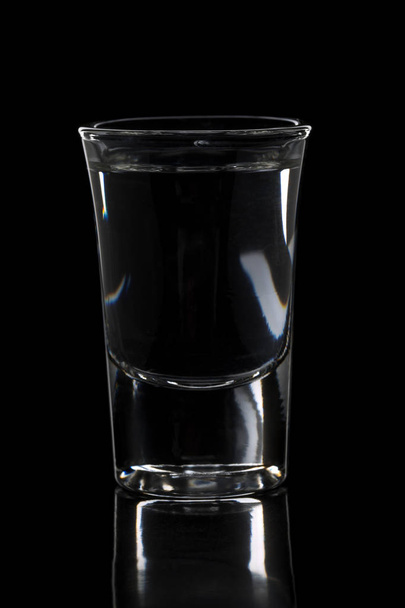 German hard liquor Korn Schnapps in shot glass - Foto, afbeelding