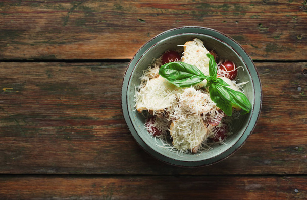 Salad with radish, toasts and parmesan cheese - 写真・画像