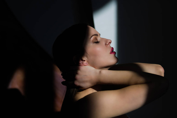 Sexy young woman posing in a natural lighting - Valokuva, kuva