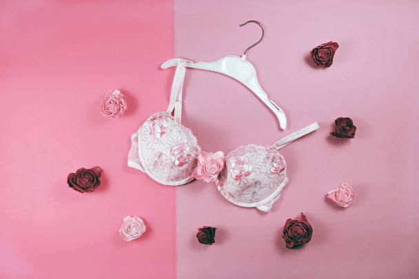 Lace bra on pink background, fashion concept - Фото, изображение