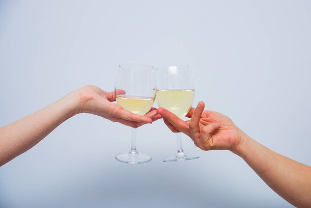 two glasses of champagne in womens hands. - Zdjęcie, obraz